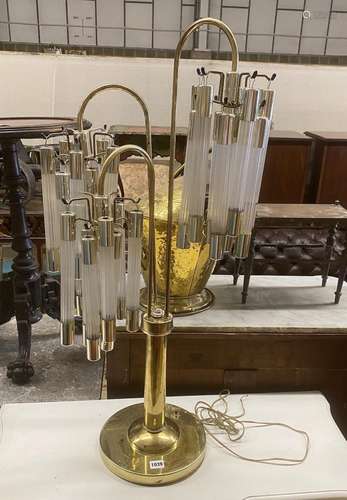 A contemporary brass and perspex three branch table lamp, he...