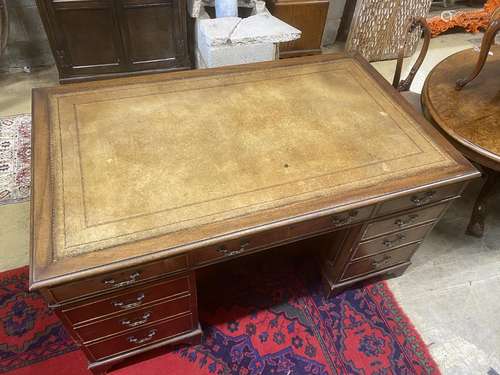 A reproduction George III style mahogany pedestal desk, leng...