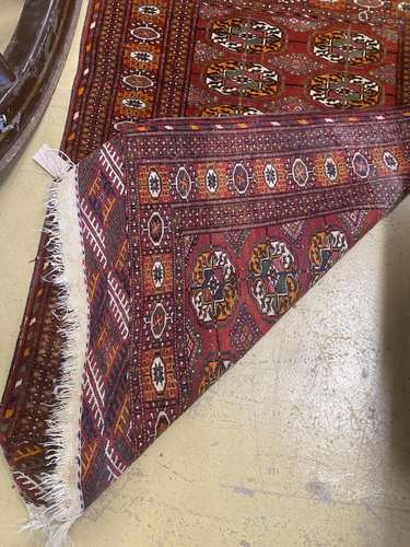 A North West Persian rug and a Bokhara rug, larger 114 x 84c...