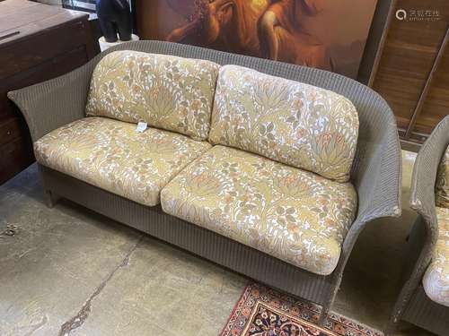 A pair of Lloyd Loom garden settees with William Morris fabr...