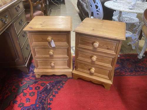 A pair of pine three drawer bedside chests, width 41cm, dept...