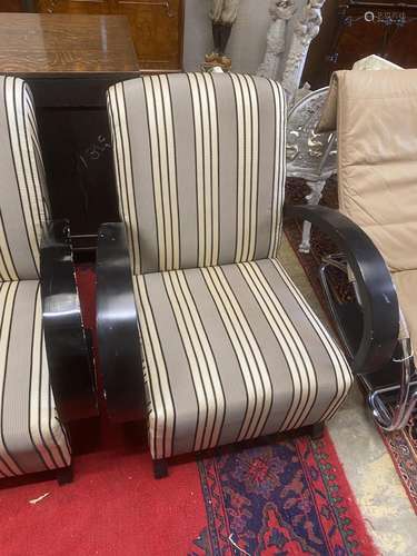 A pair of Deco style ebonised upholstered armchairs, width 7...