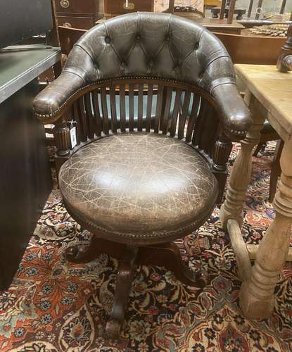 A Victorian mahogany buttoned brown leather swivel desk chai...