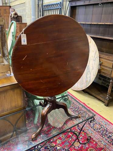 A George III and later mahogany circular tilt top tripod tea...