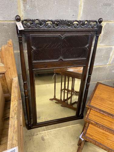 An early 20th century Jacobean revival oak wall mirror, widt...