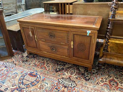 A Chinese caved hardwood media cabinet, width 112cm, depth 4...