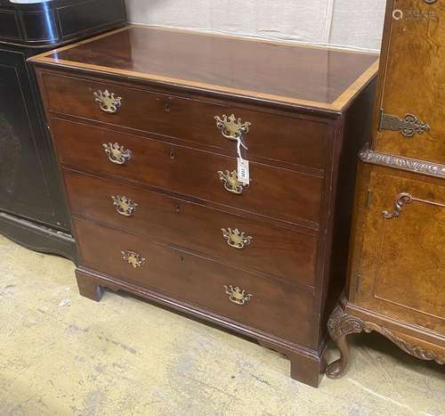 A George III satinwood banded mahogany four drawer chest, wi...