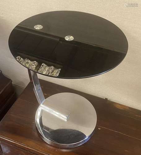 A chrome and black glass circular occasional table, diameter...