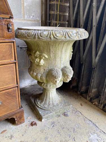 A circular reconstituted stone campana garden urn, diameter ...