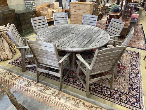 Lazy Dayz, New Zealand, a circular teak garden table, diamet...