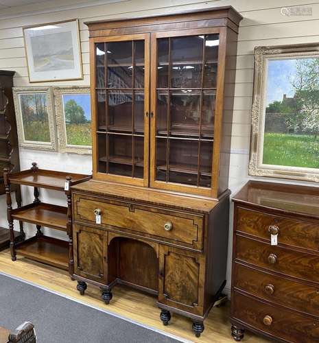 A George IV ebony banded mahogany secretaire kneehole bookca...