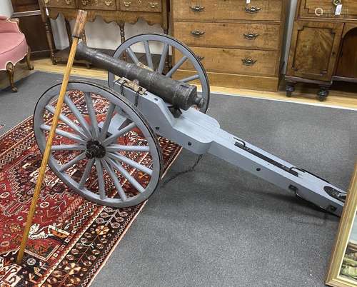 A model artillery cannon with composition barrel on painted ...