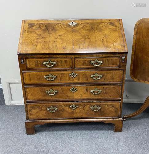 A George I feather banded walnut bureau, width 91cm, depth 5...