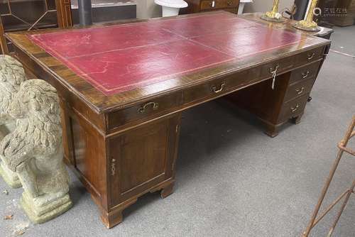 A large 1920s George III mahogany pedestal partners desk, tw...