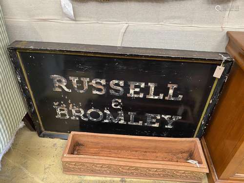 A vintage rectangular painted Russell & Bromley advertis...