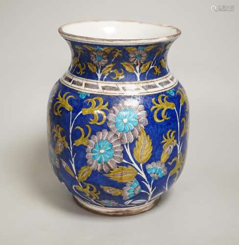 A Turkish Iznik pottery vase, decorated with flowers, 20cm h...