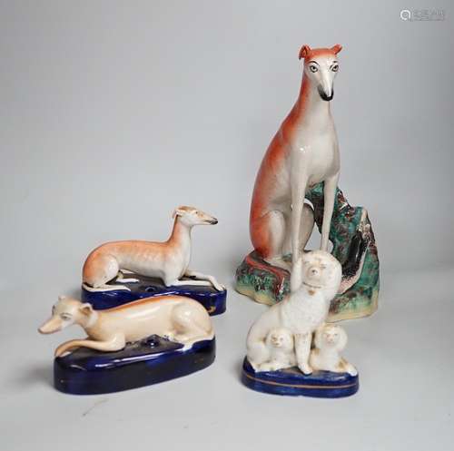 Four Staffordshire dogs including greyhounds and a spaniel, ...