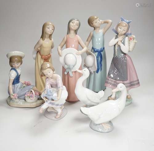 Six Lladro figures of girls, three with hats, one with a Ted...