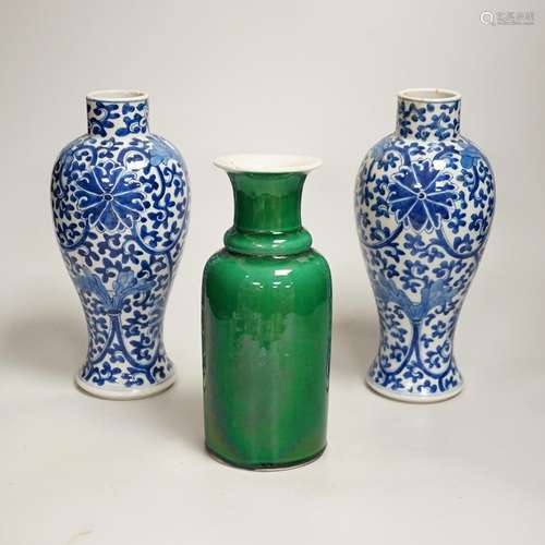 A pair of Chinese blue and white vases and a green glazed va...