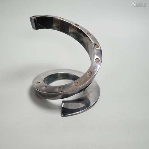 A contemporary Danish style coiled candlestick in chrome fin...