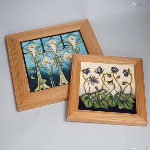 Two framed Moorcroft tiles, one with stylised lilies, the sm...