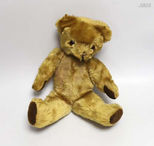 A mid 20th century teddy bear, probably Merrythought, 37cm h...