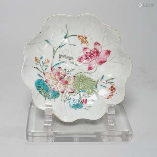 A Chinese famille rose lotus leaf shaped saucer dish, Qianlo...