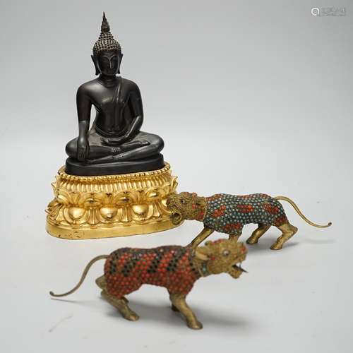 A Thai bronze Buddha raised on a gilt base and two filigree ...