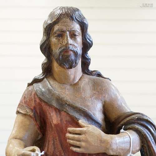 An antique carved and painted wood figure of Christ with a s...