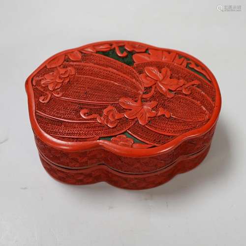 A Chinese cinnabar lacquer box and cover, decorated with bit...