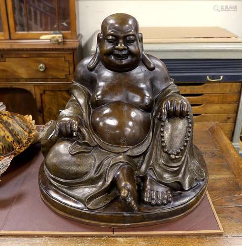 A massive Chinese bronze seated figure of Budai, 62cm high