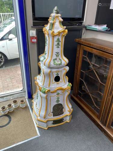 A large German faience Kachelofen oven / room heater, sectio...