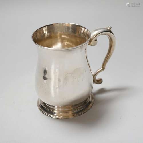 A George II silver baluster mug with scroll handle, makers m...