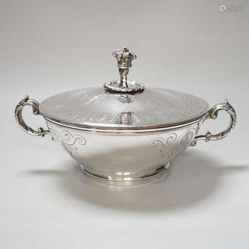 A Victorian silver tureen and cover, with hand holding crown...