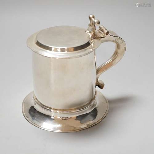 A Charles II style white metal mustard pot modelled as a tan...