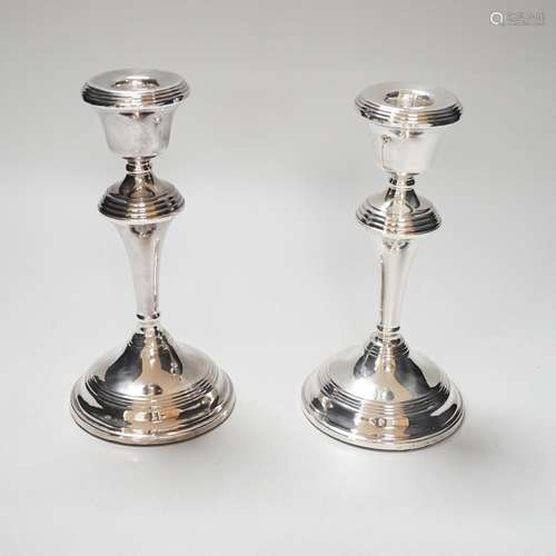 A pair of Elizabeth II silver candlesticks, loaded, Birmingh...