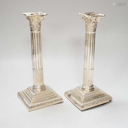 A pair of late Victorian silver Corinthian column candlestic...