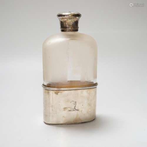 A Victorian silver mounted glass pocket flask, with crested ...