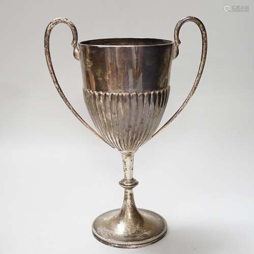 An Edwardian two handled silver trophy cup with demi fluted ...