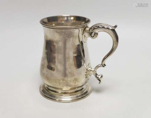 A George III silver baluster mug, with later monogram and ac...