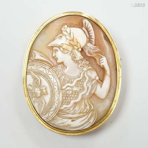 A gold mounted cameo brooch, carved with a classical warrior...