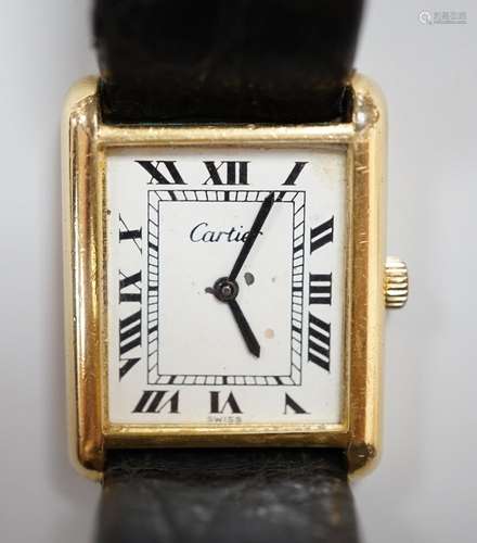 A ladys gold plated Cartier Tank wrist watch, with quartz mo...