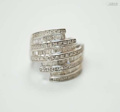 A 9ct white gold and dress ring designed with nine bands of ...