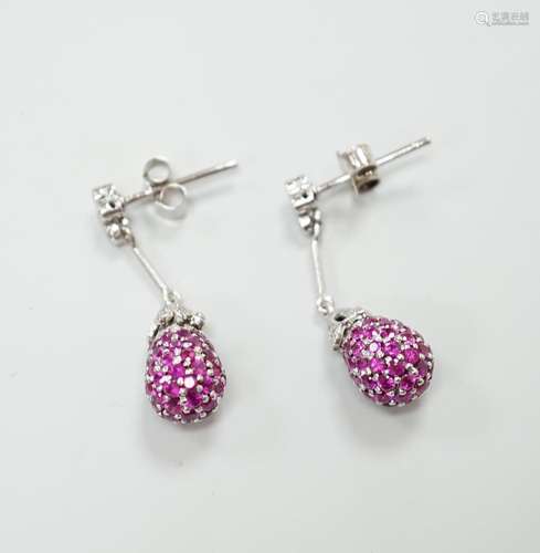 A pair of 18ct white gold ruby and diamond set drop earrings...