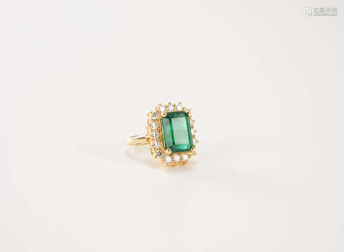 A 18K Gold 8.30 Carats Emerald & Diamond Ring.