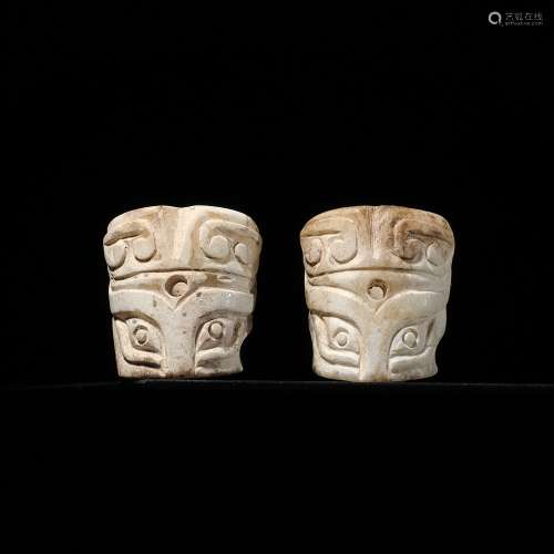 A PAIR OF CYLINDRICAL ‘TAOTIE MASK’ JADE BEADS, SHANG DYNAST...