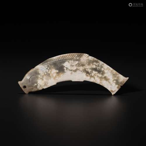A DEEP CELADON JADE ‘FISH’ PENDANT, LATE SHANG TO WESTERN ZH...
