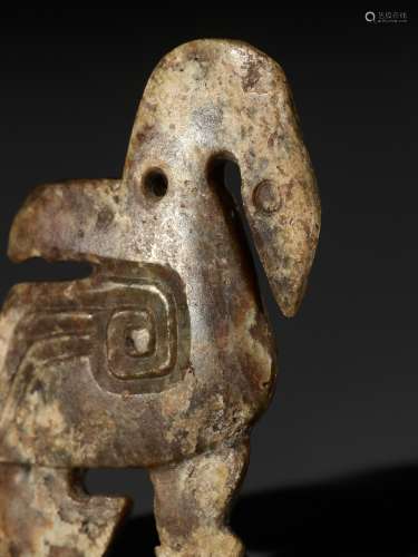 A 'TWO-FACE' JADE PENDANT DEPICTING A MYTHICAL WATERBIRD, LA...