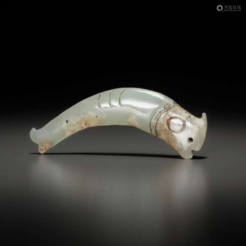 A PALE CELADON ‘FISH’ PENDANT, LATE SHANG TO EARLY WESTERN Z...