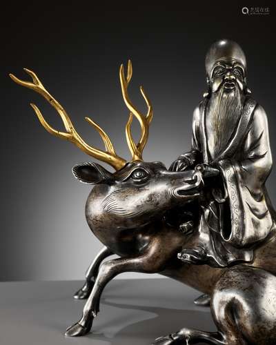 A SILVERED AND GILT BRONZE ‘SHOULAO AND DEER’ INCENSE BURNER...